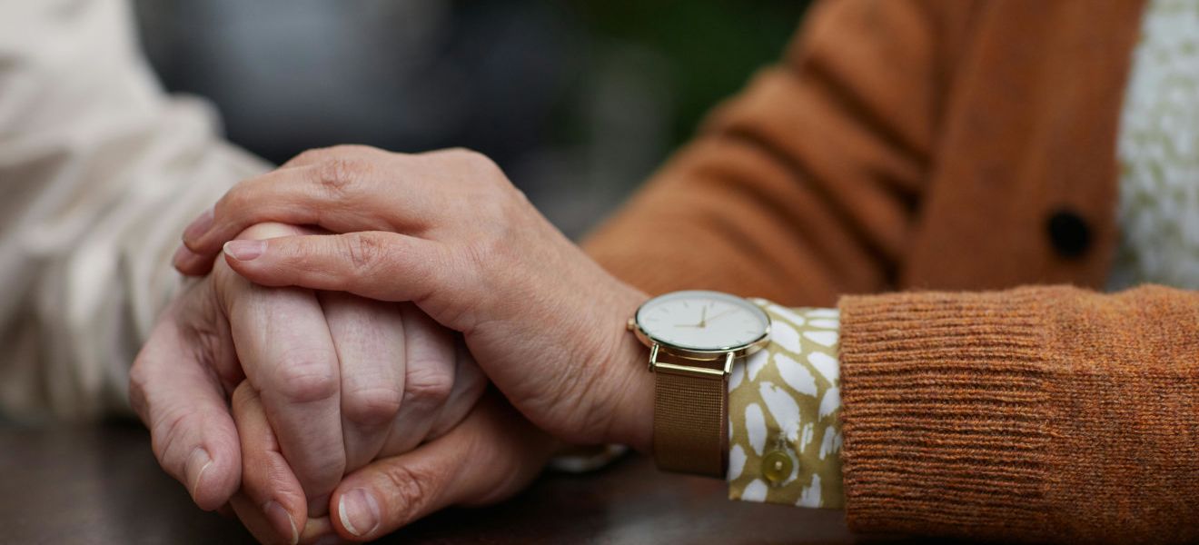 Couple holding hands