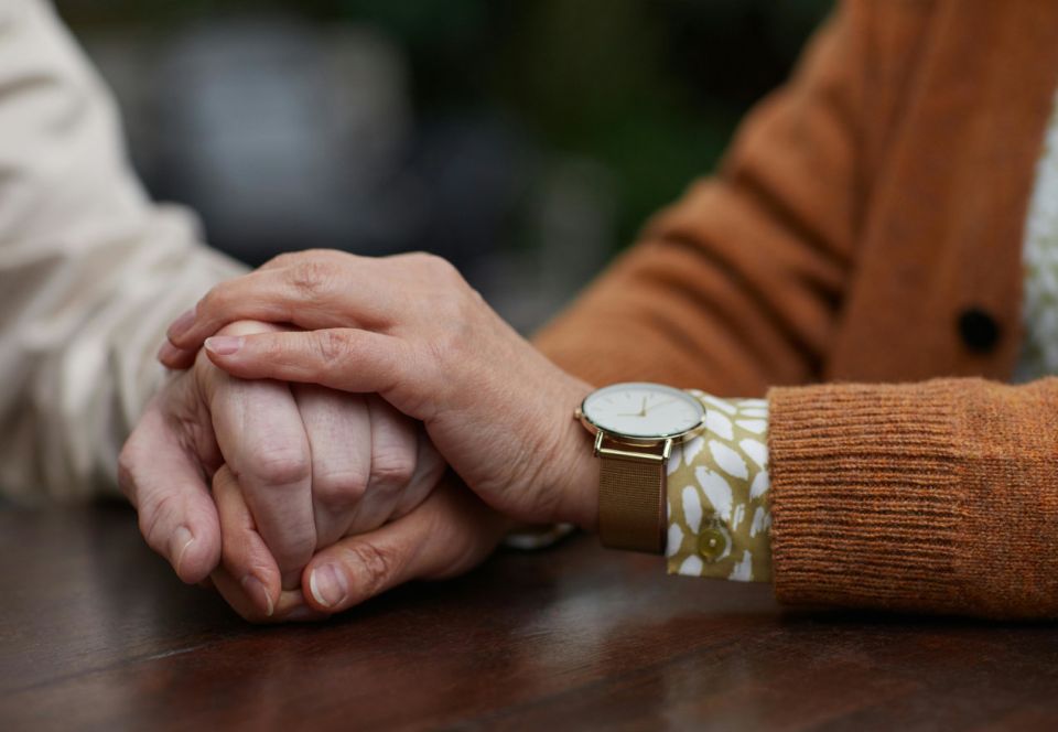 Couple holding hands